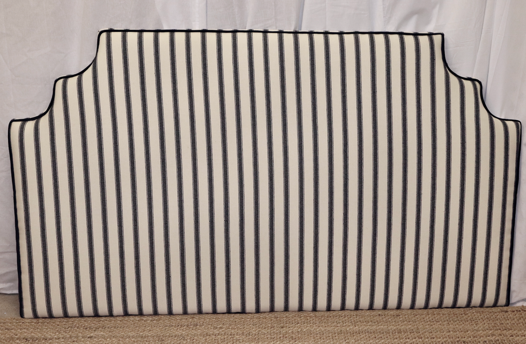 The arch in navy herringbone stripes with black velvet piping.